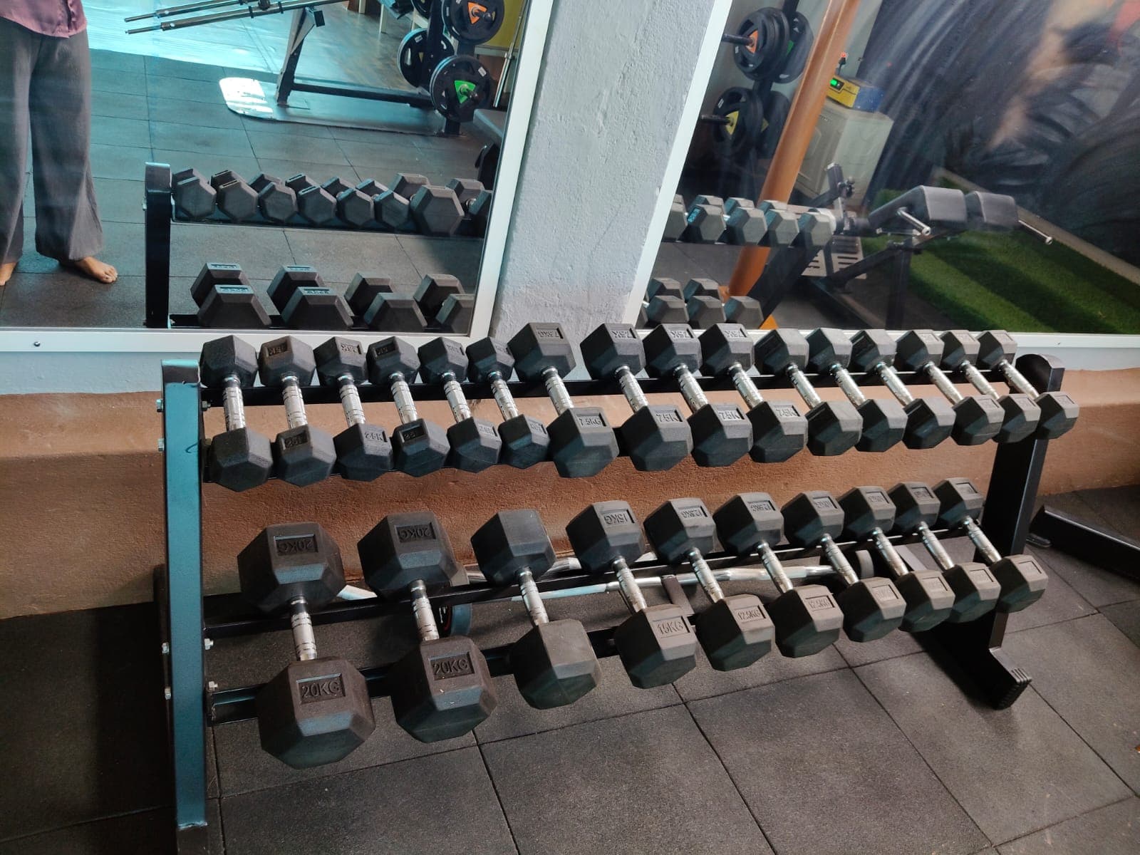 Organized dumbbell rack in the strength training area.